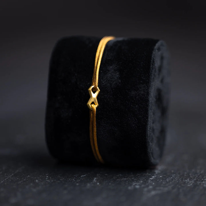 Nylonarmband 1,5 mm, braun, Infinity-Zeichen vergoldet